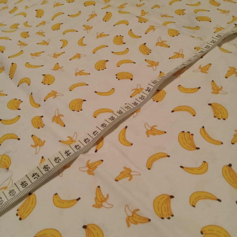 Cotton fabric with banana pattern on white background